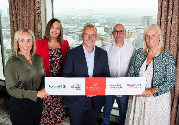 A group of people holding a banner

AI-generated content may be incorrect.